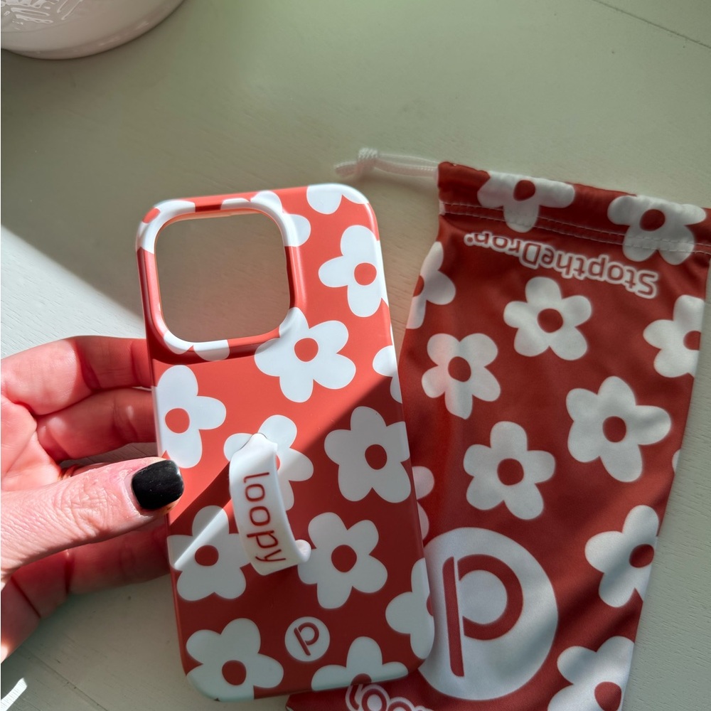 Gently Worn iPhone 15 Pro Loopy Case Coral with White Daisy Pattern